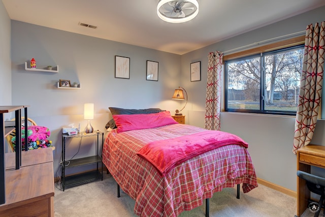 bedroom with light colored carpet