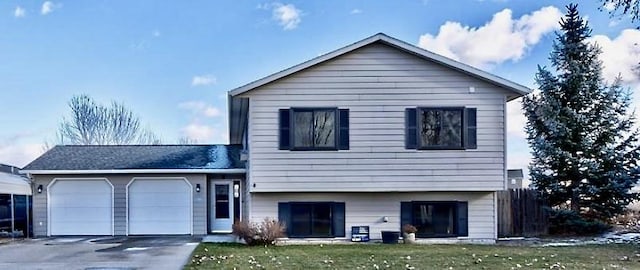 tri-level home with a front yard