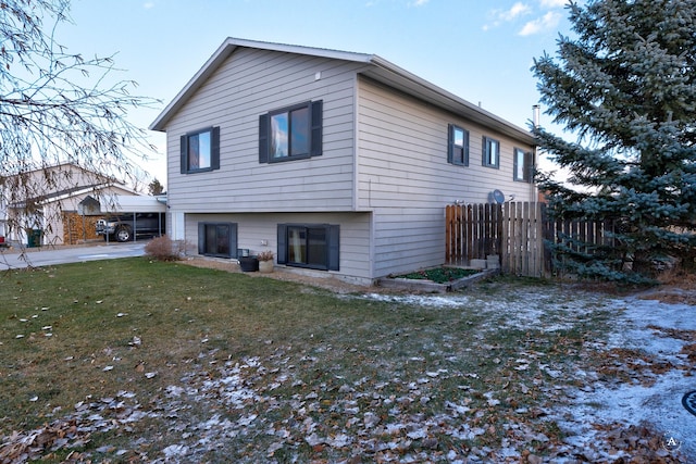 back of house featuring a lawn