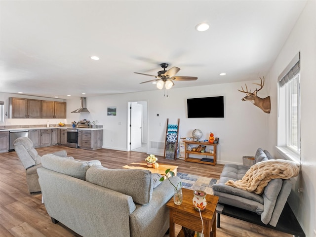 4 Sapphire Way, Sheridan, MT 59749 - living room with recessed lighting, ceiling fan, light wood-type flooring, baseboards, and bar