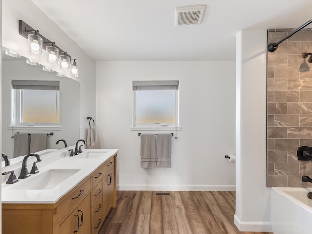 4 Sapphire Way, Sheridan, MT 59749 - bathroom with double vanity, wood finished floors, washtub / shower combination, and baseboards