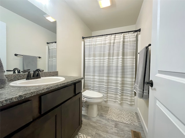 full bathroom featuring vanity, toilet, and shower / bathtub combination with curtain