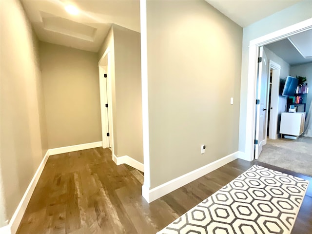 hall with hardwood / wood-style floors