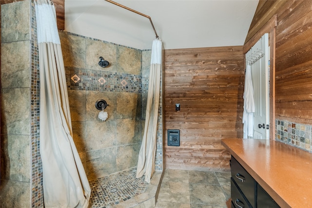 bathroom with curtained shower and wooden walls