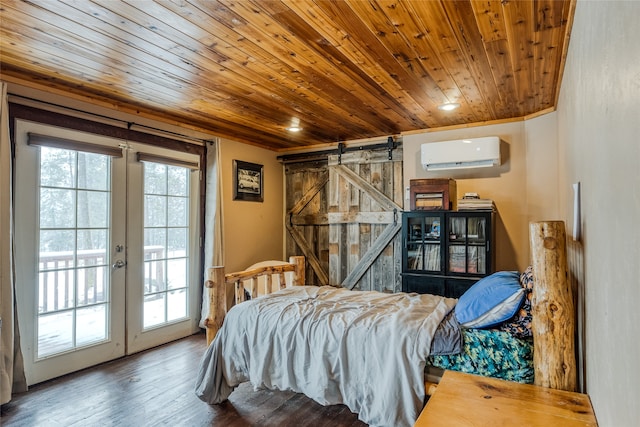 bedroom with french doors, a barn door, an AC wall unit, wood-type flooring, and access to outside