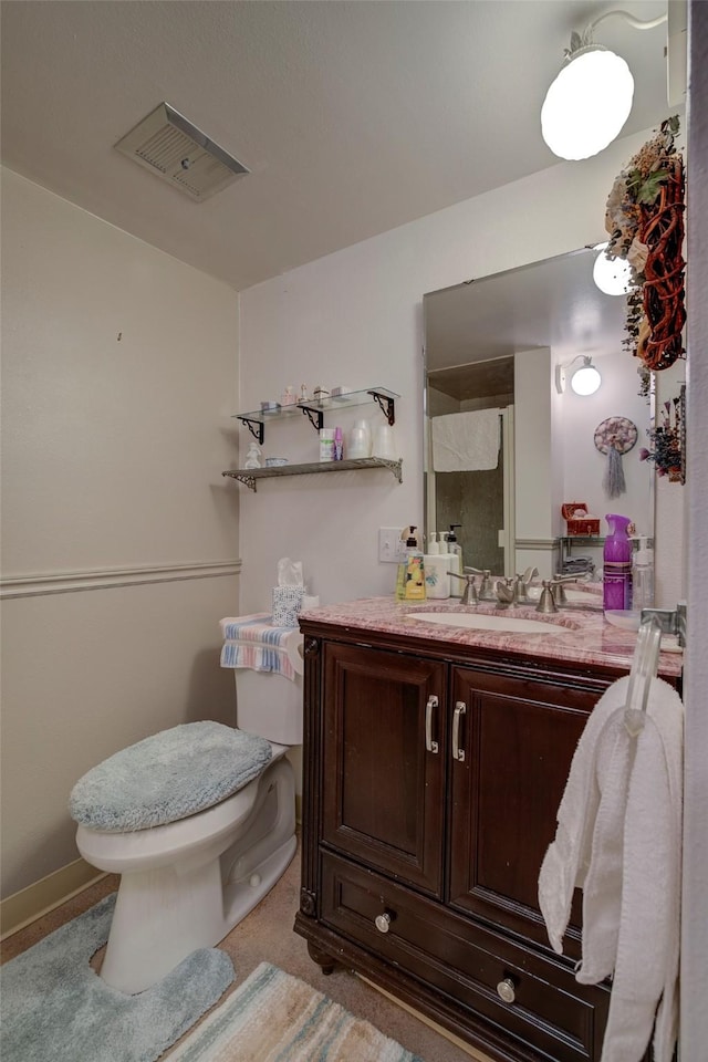 bathroom with vanity and toilet