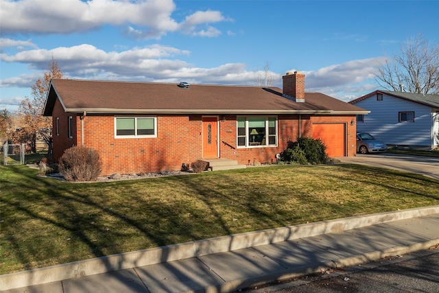 single story home with a front yard and a garage