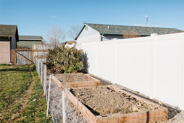 view of yard featuring a garden and fence