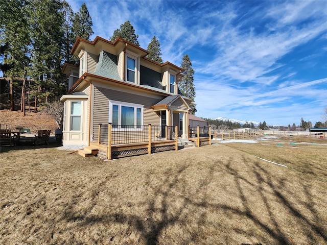 view of front of house with a wooden deck