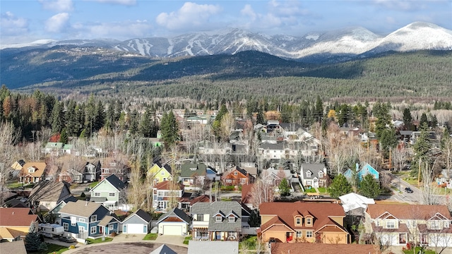 birds eye view of property with a mountain view