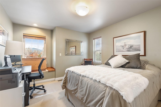 659 Copperwood Ct, Whitefish, MT 59937 - bedroom featuring light carpet, multiple windows, a desk, baseboards, and recessed lighting