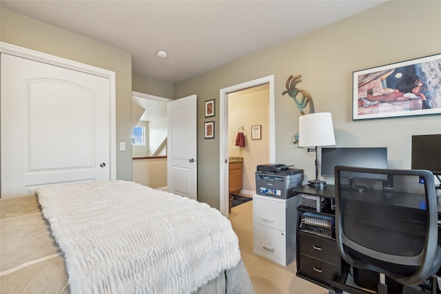 659 Copperwood Ct, Whitefish, MT 59937 - bedroom with light carpet, an office area, and connected bathroom