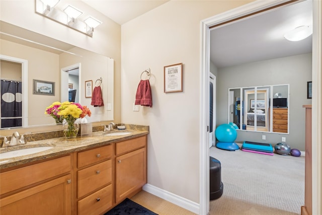 659 Copperwood Ct, Whitefish, MT 59937 - bathroom with double vanity and baseboards