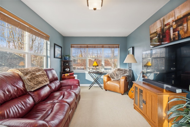 living room with light carpet and a healthy amount of sunlight