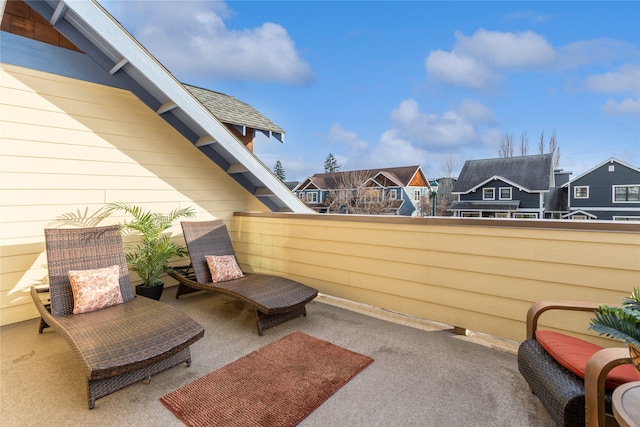 view of patio featuring a balcony