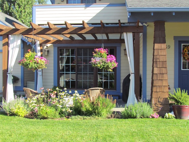 property entrance featuring a pergola and a lawn