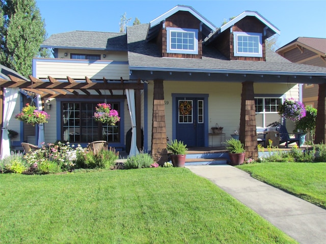 craftsman-style home with a porch, a pergola, and a front lawn