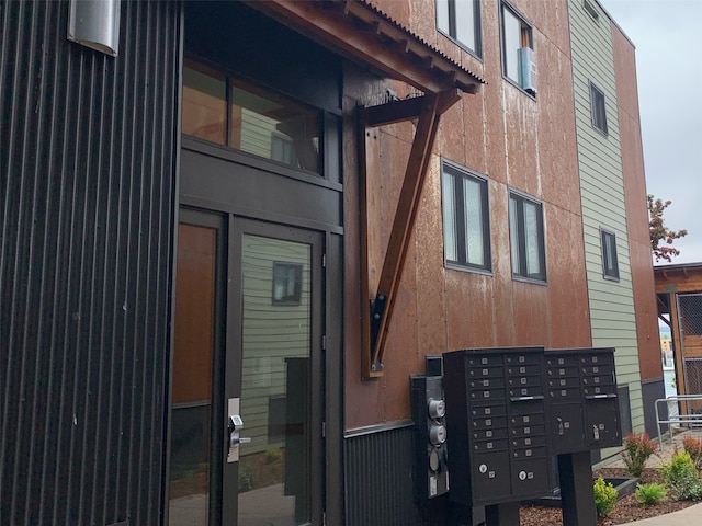 view of side of property featuring a mail area