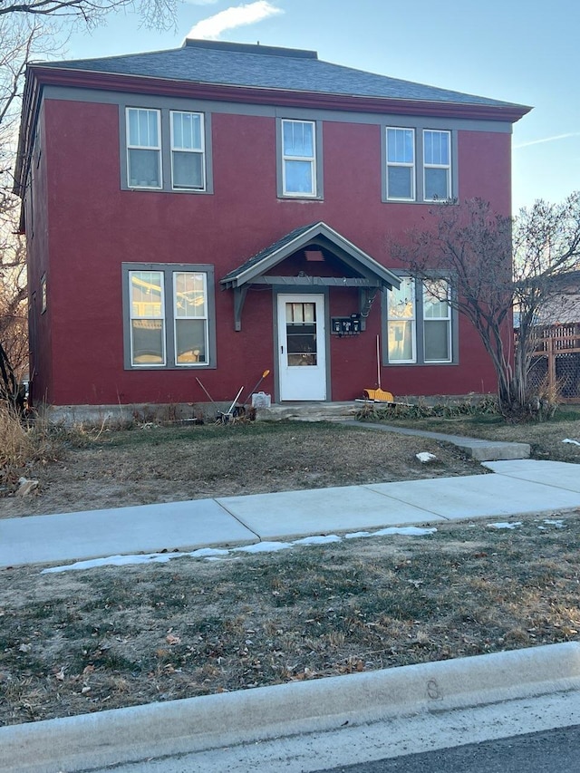 811 N Rodney St, Helena, MT 59601 - view of front facade featuring stucco siding and a shingled roof