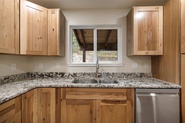 kitchen with dishwasher, light stone countertops, sink, and light brown cabinets