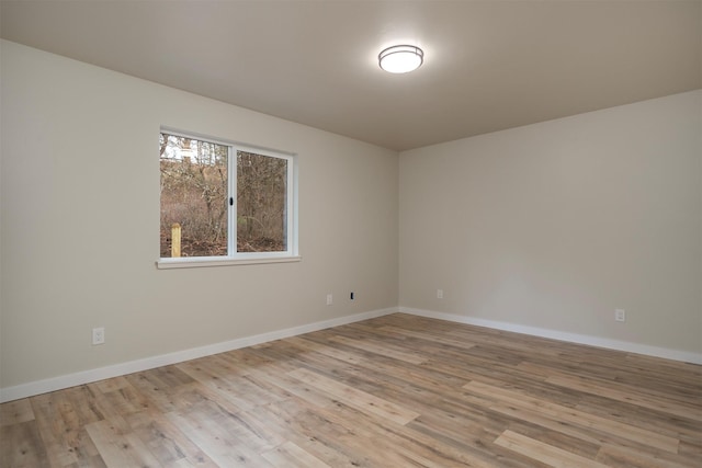 unfurnished room with light hardwood / wood-style flooring