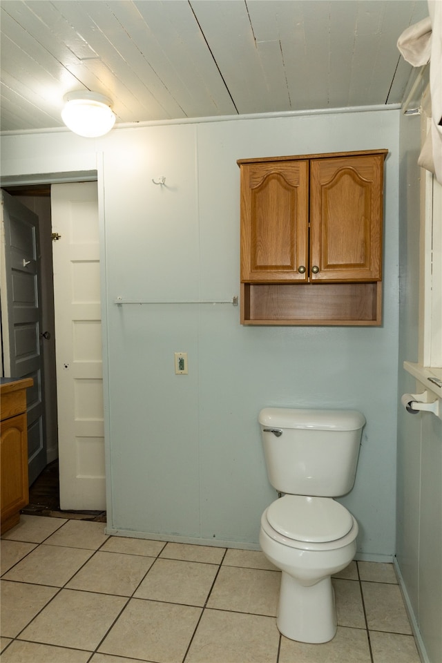 bathroom featuring toilet, tile patterned floors, and wood ceiling