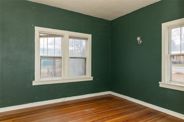 empty room featuring hardwood / wood-style flooring