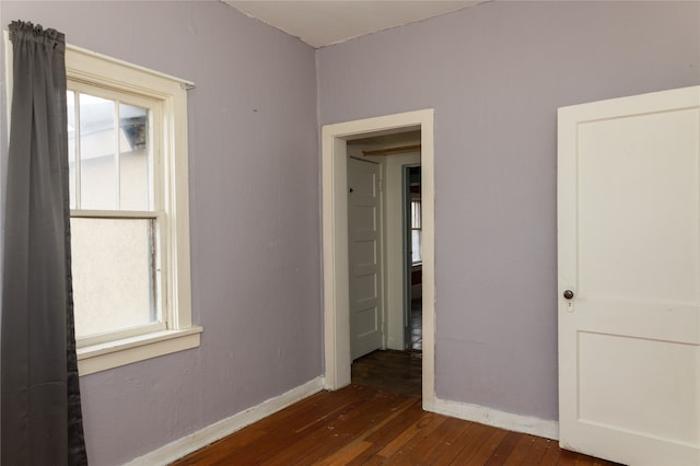 spare room featuring dark hardwood / wood-style floors