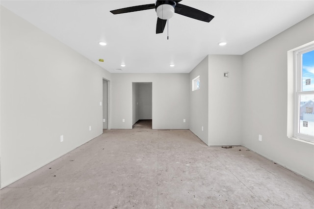 unfurnished room featuring recessed lighting, plenty of natural light, and a ceiling fan