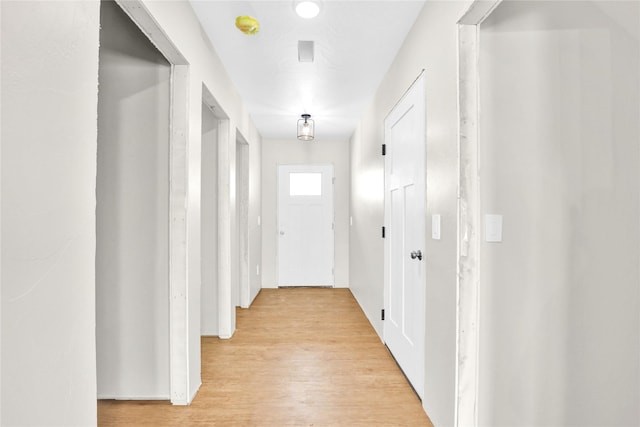 hallway with light wood finished floors