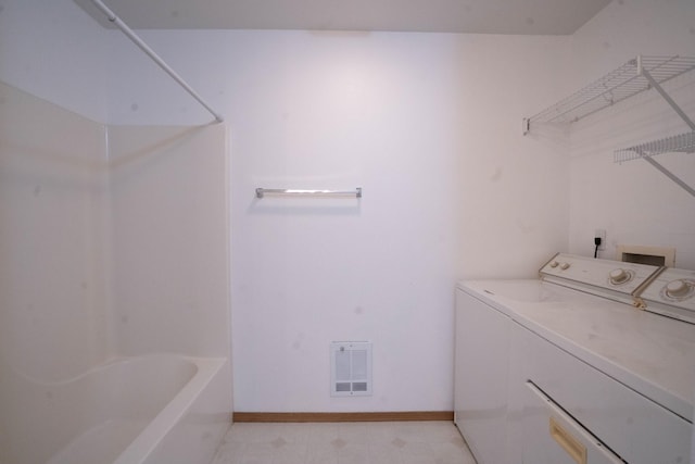 laundry room with washer and dryer