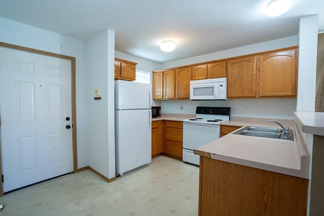 kitchen with white appliances and sink