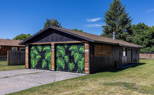 garage featuring a lawn