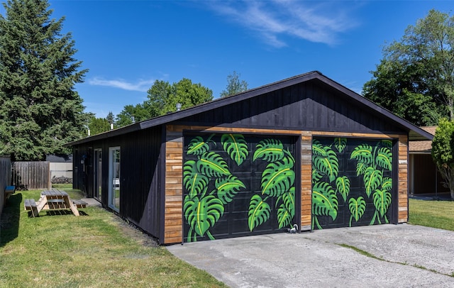 garage featuring a yard