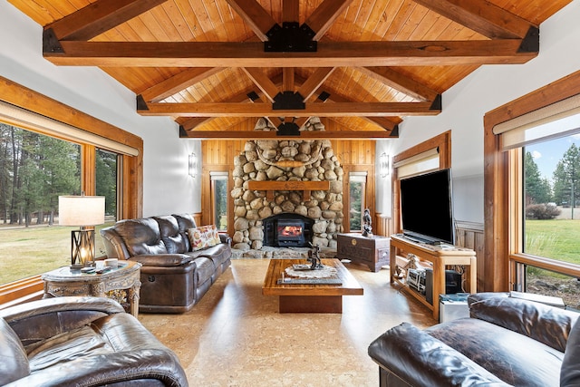 living room featuring beamed ceiling, wooden ceiling, a fireplace, and high vaulted ceiling