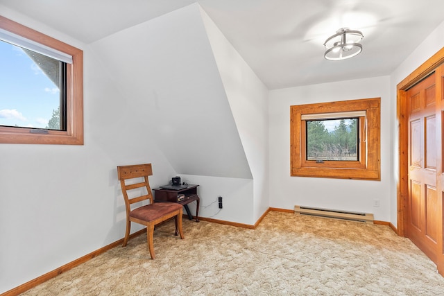 sitting room featuring a baseboard radiator, vaulted ceiling, a wealth of natural light, and light colored carpet