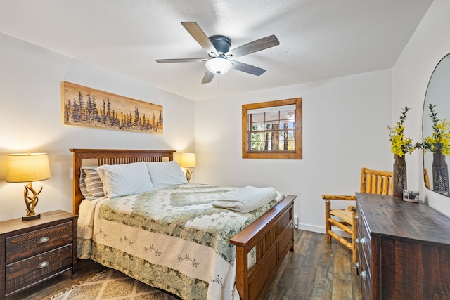 bedroom featuring ceiling fan and dark wood-type flooring