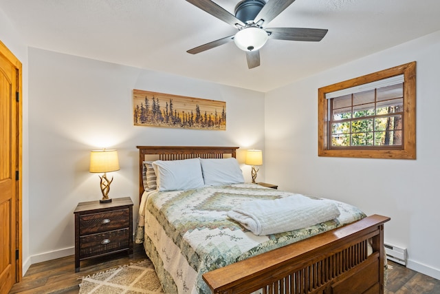 bedroom featuring baseboard heating, ceiling fan, and dark hardwood / wood-style flooring