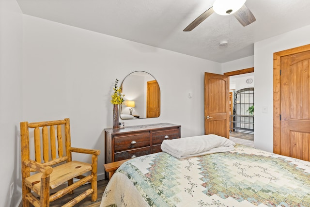 bedroom featuring ceiling fan and wood-type flooring