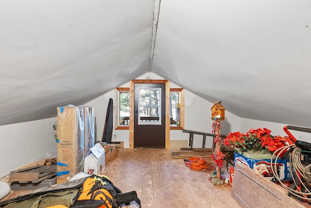 bonus room with hardwood / wood-style floors and lofted ceiling