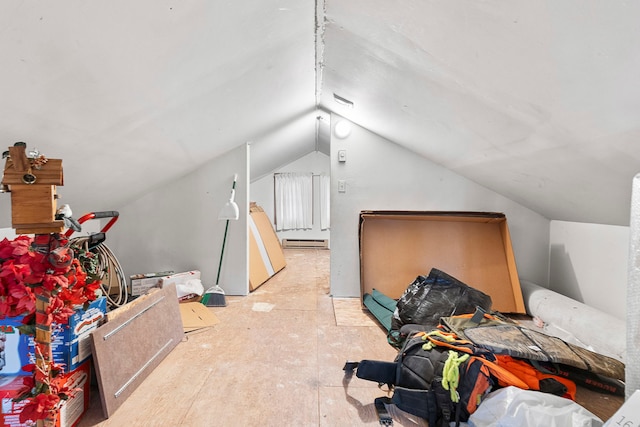 interior space featuring baseboard heating and vaulted ceiling