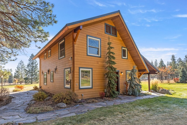 view of property exterior featuring a yard