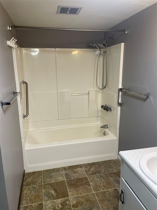 bathroom with vanity and tub / shower combination