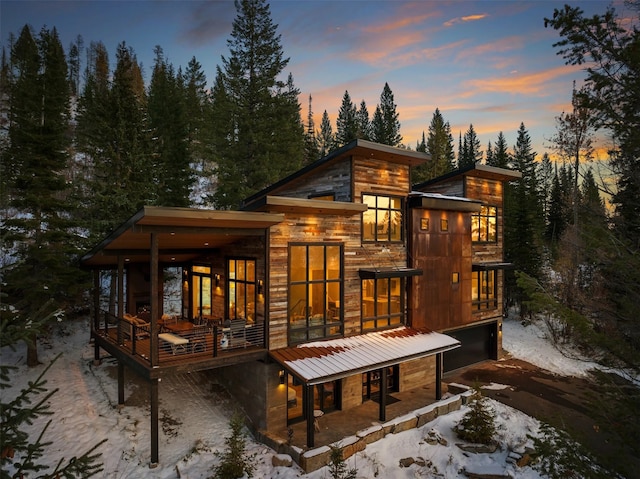 view of snow covered house