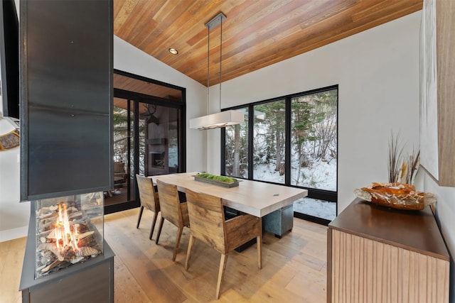 1148 Glades Dr, Whitefish, MT 59937 - dining area with lofted ceiling, light wood-type flooring, and wooden ceiling