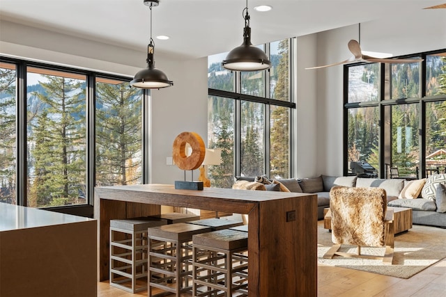 1148 Glades Dr, Whitefish, MT 59937 - bar with hardwood / wood-style floors, recessed lighting, and decorative light fixtures