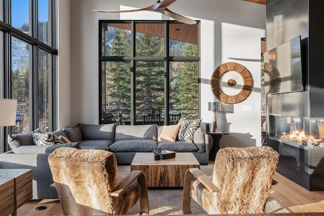 1148 Glades Dr, Whitefish, MT 59937 - living room featuring hardwood / wood-style floors and a towering ceiling