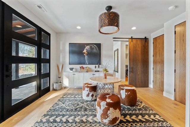 1148 Glades Dr, Whitefish, MT 59937 - interior space featuring a barn door and light wood-type flooring