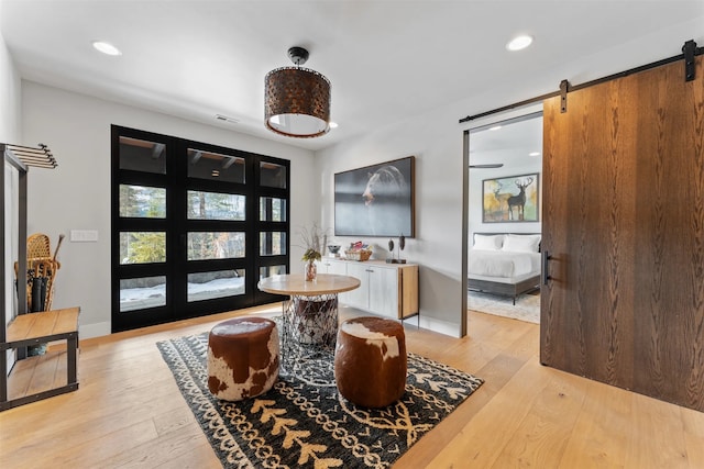 1148 Glades Dr, Whitefish, MT 59937 - interior space featuring a barn door and light hardwood / wood-style floors