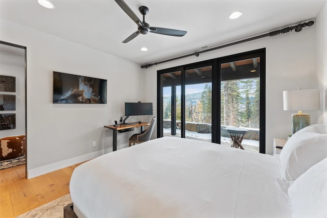 1148 Glades Dr, Whitefish, MT 59937 - bedroom with ceiling fan, access to exterior, and wood-type flooring